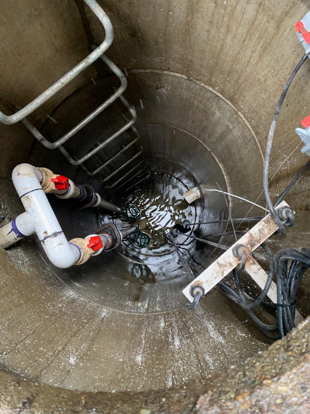 confined space pump in water filled well